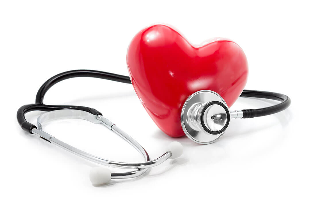 Heart Representing High Blood Pressure Awareness Month-lies next to a stethoscope