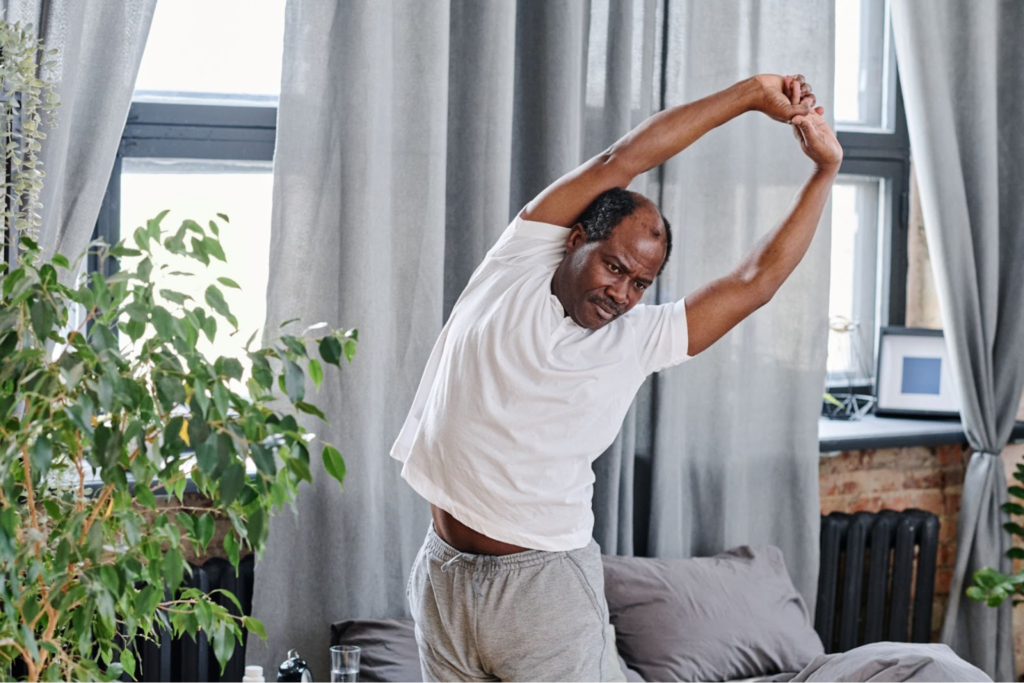 A man stretching in the morning.